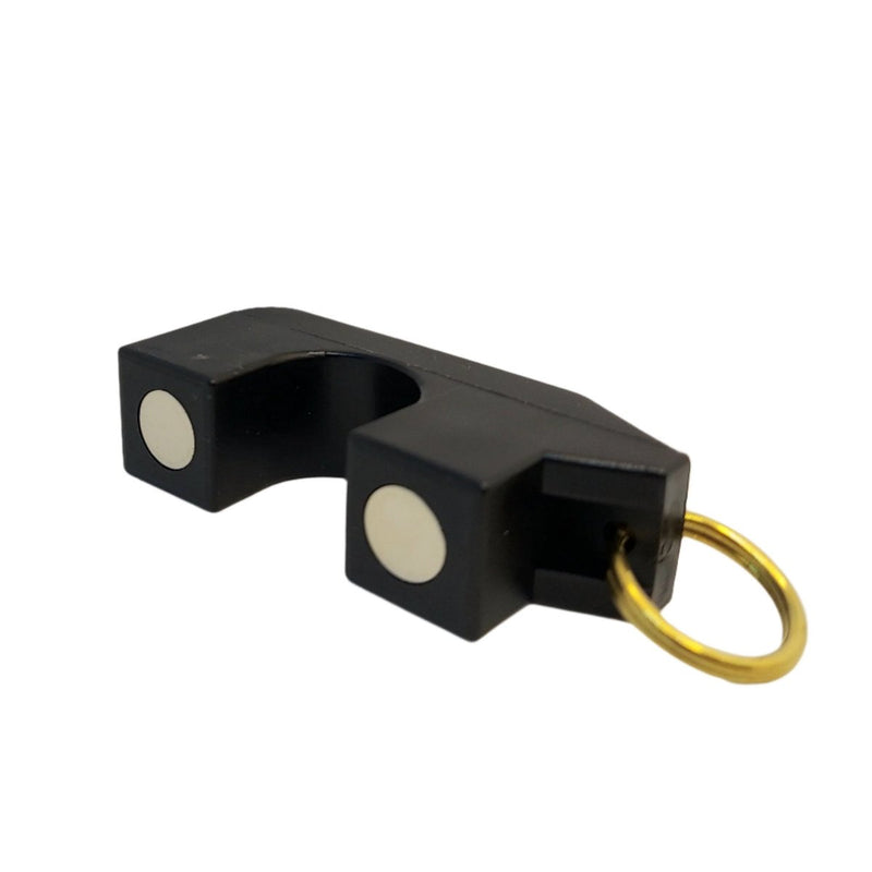 Magnetic rod holder with black block housing, circular light magnets, and gold ring