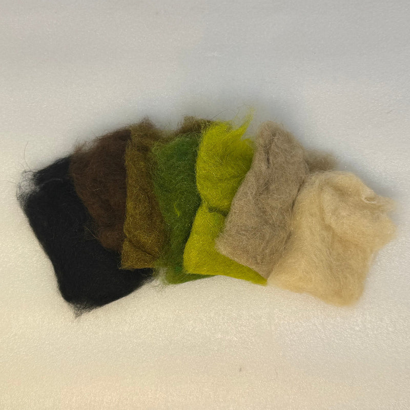 Assorted dubbing fibers in dark, olive, lime, tan, and cream