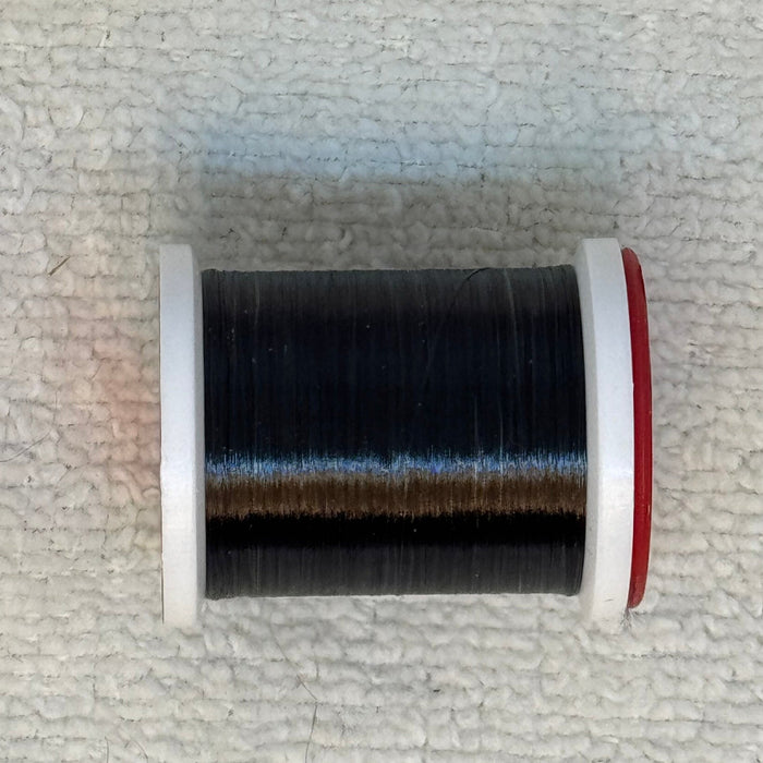 Close up of BLACK spool ultra thread #70