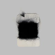 Leech mohair yarn tuft on card, black
