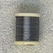 Four-strand floss spool in dark gray-blue