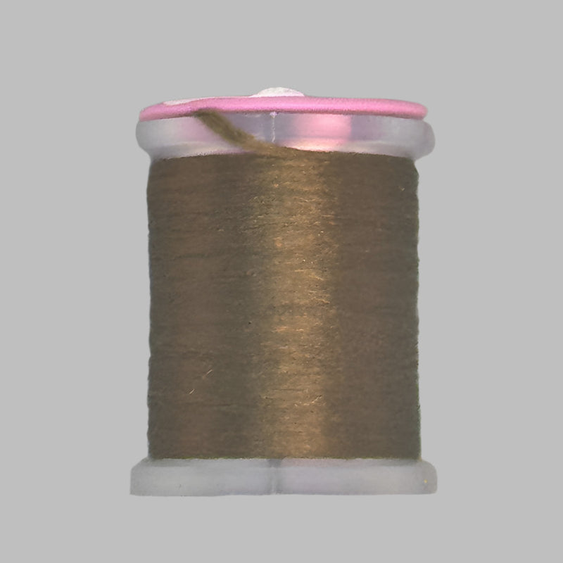 Tan brown Antron yarn spool with clear plastic rim and end caps