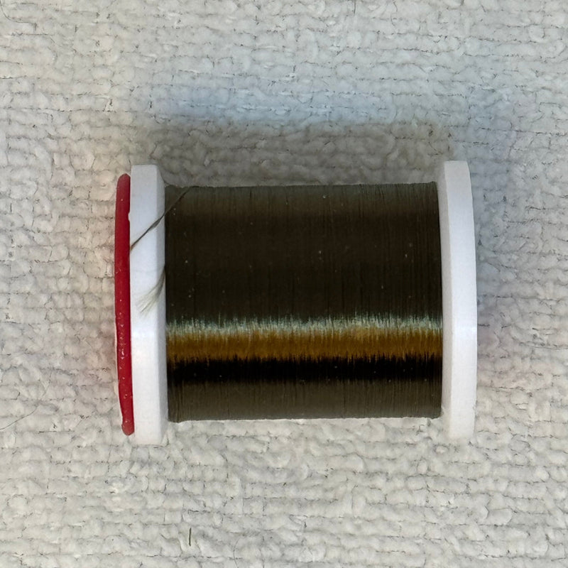 Spool of 70 denier thread in dark brown with gold sheen