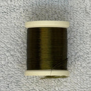 Four-strand floss spool with dark olive green thread and loose strand ends