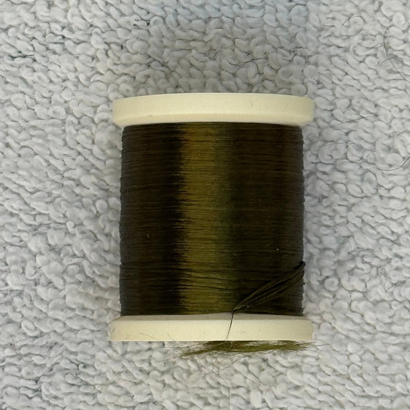 Four-strand floss spool with dark olive green thread and loose strand ends