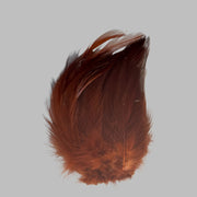 Strung neck hackle feathers, dark reddish-brown with fine feather fibers