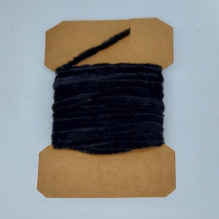 a card of black chenille