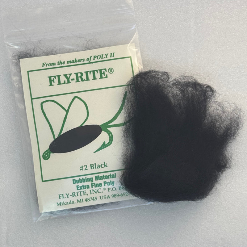Fly dubbing material packet with black fibers