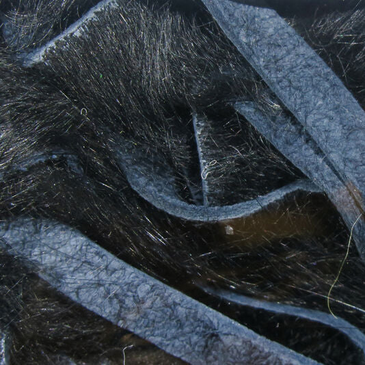 Crosscut rabbit fur strands in black with blue thread