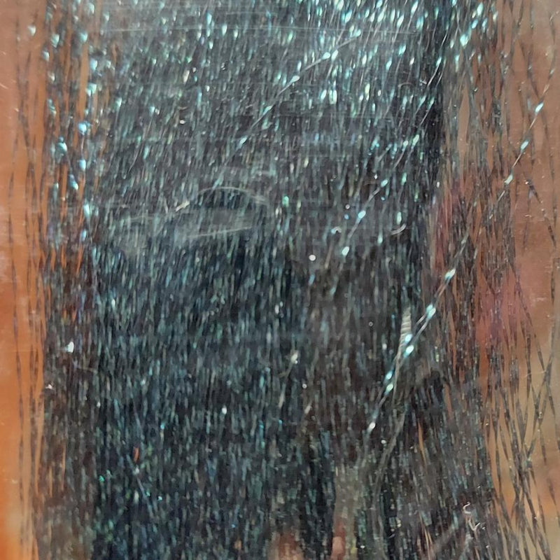 Teal and silver sparkly tinsel fibers with fine glitter