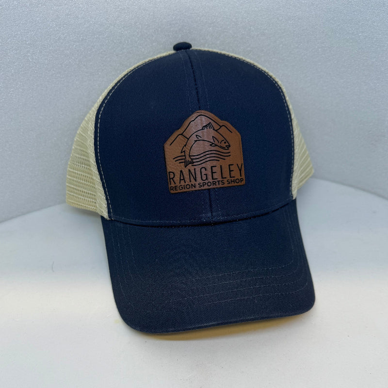 Dark blue mesh trucker cap with brown leather patch logo on front