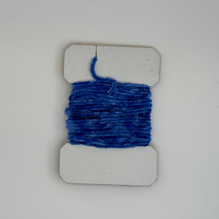 Blue fine chenille horizontally wrapped around white card