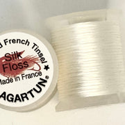 French silk floss spool with tightly wound white thread