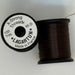 Spools of brown thread from two angles side by side