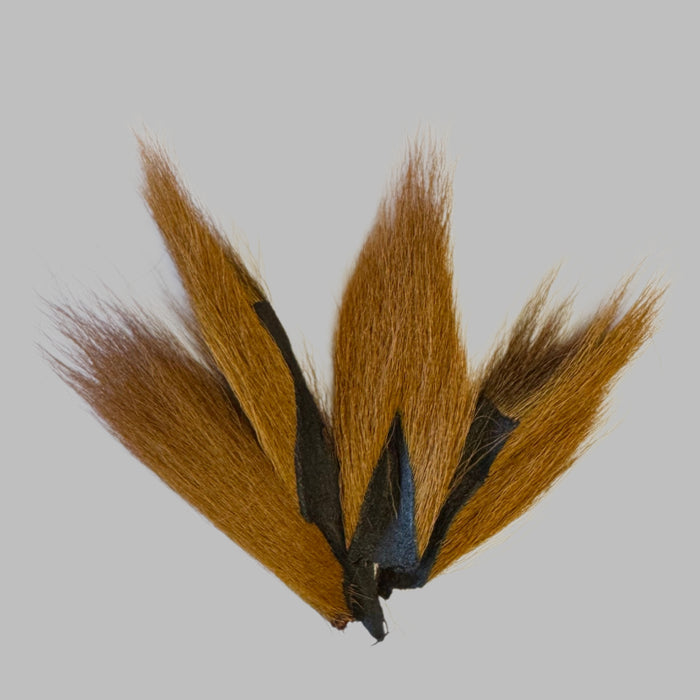 Four brown bucktail pieces
