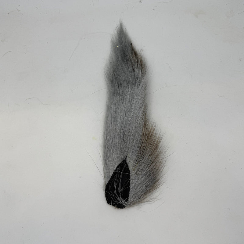 Gray bucktail tuft with black base
