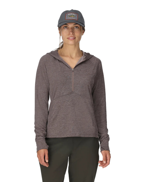 Woman wearing a brownish hoodie and cap on a white background