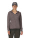 Woman wearing a brownish hoodie and cap on a white background