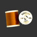 Burnt Orange spool of thread from top and side view 