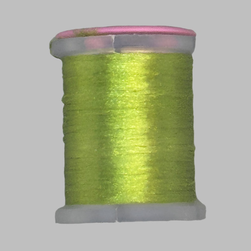 Yellow-green Antron yarn spool with clear plastic rim and end caps