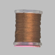 Warm brown Antron yarn spool with clear plastic rim and end caps