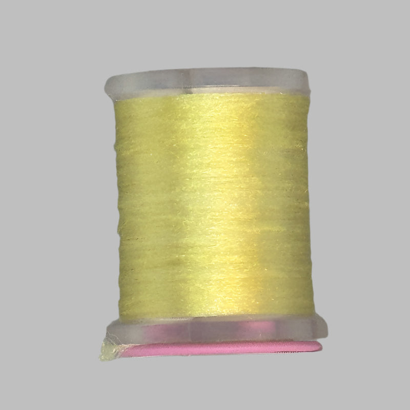 UTC Antron yarn spool in light yellow on a clear bobbin with pink top ring