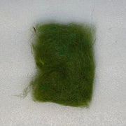 Green dubbing fibers clump