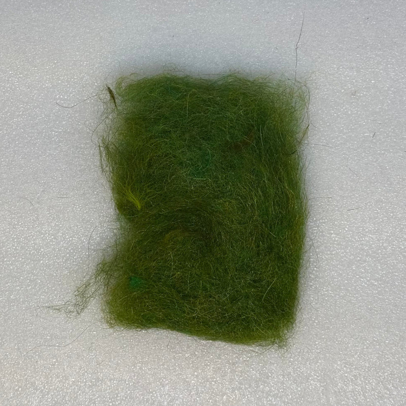 Green dubbing fibers clump