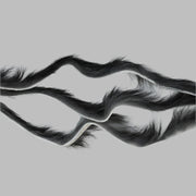 Zonker strips in black, long fur strip with curled wave texture and sparse base