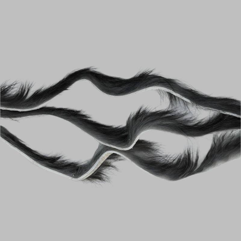 Zonker strips in black, long fur strip with curled wave texture and sparse base