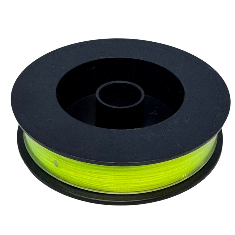 Fly line backing spool with neon green line wound on black reel