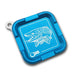 A blue magnetic fly holder with hook jaw fish design etched in