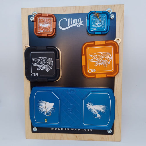 a countertop display with the 3 colors and sizes of Cling magnetic fly, hook, and tool patches