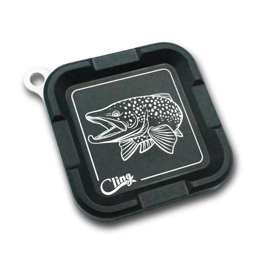 A black magnetic fly holder with hook jaw fish design etched in