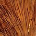 Copper colored tinsel flash strands close up