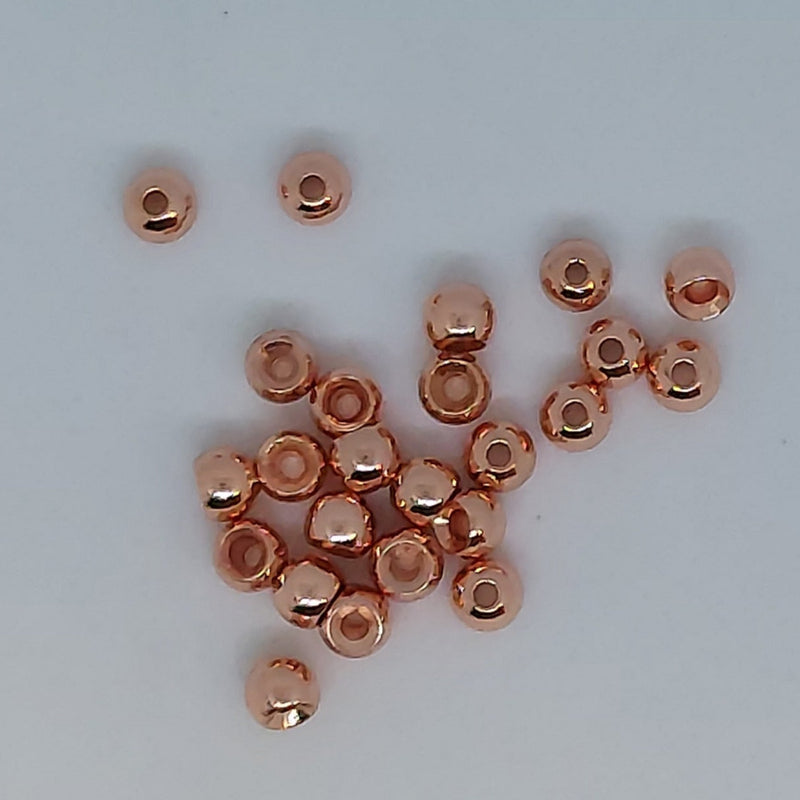 Cyclops beads rose gold round beads with center hole