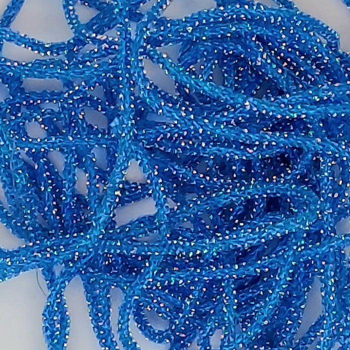 a close up of the string-like, shiny material called core braid