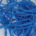 a close up of the string-like, shiny material called core braid