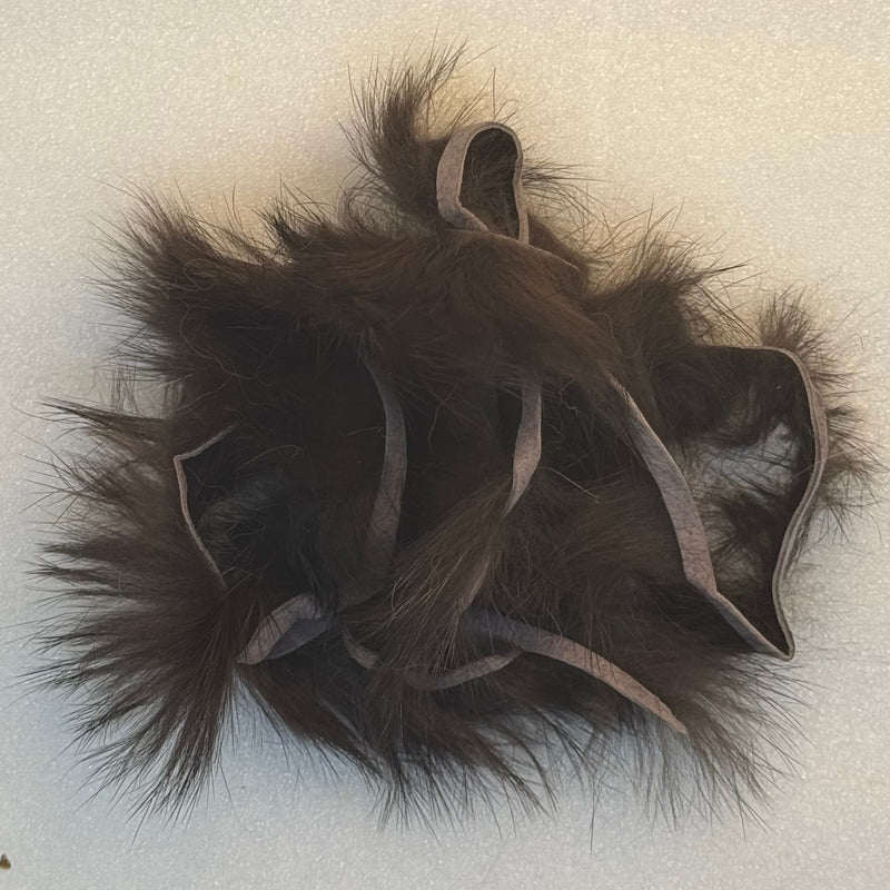 Crosscut rabbit fur strands in dark brown