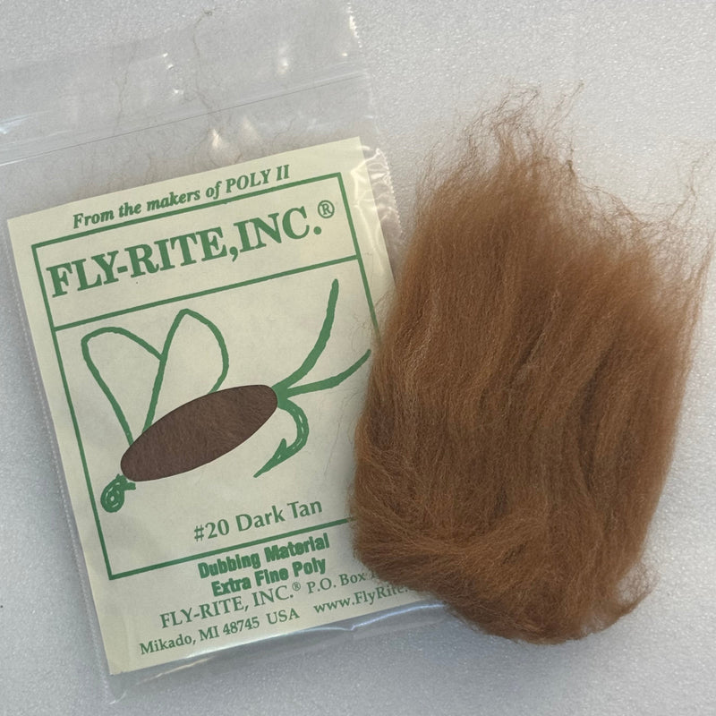 Dark tan dubbing material fibers in a clear bag with label