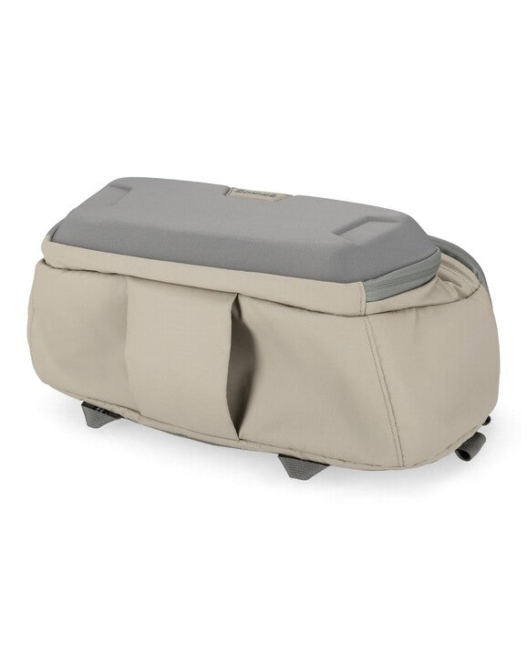 Simms sling pack with gray top and beige sides, rounded bottom for carry