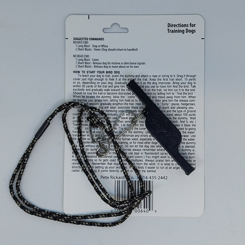 Dog training whistle with black braided cord and instruction card backing