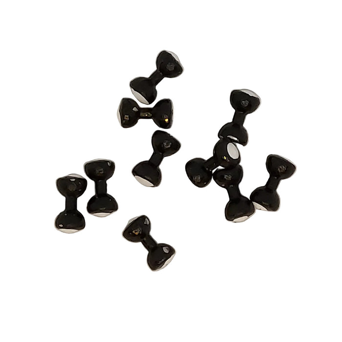 Small black dumbbell eyes scattered on a white background