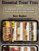 Trout fly pattern guide book with colorful fly designs shown in a tackle case