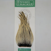 Tan and dark feather hackle on card, tapered plume with fine fibers