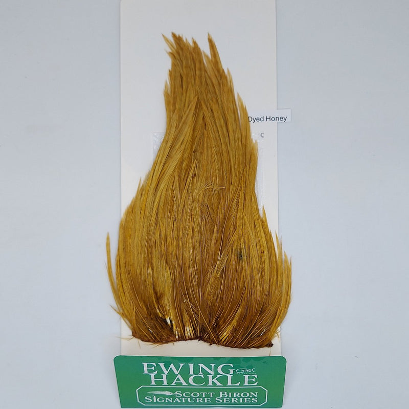 Gold honey feather hackle on card, tapered plume with fine fibers