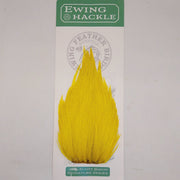 Yellow feather hackle on card, tapered plume with fine fibers