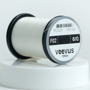 White 6/0 sewing thread spool, veevus brand label on round bobbin
