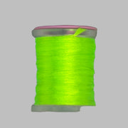 Neon yellow Antron yarn spool with clear plastic rim and end caps