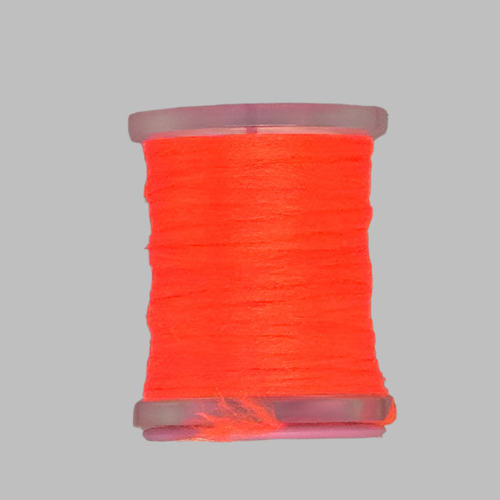 Close up spool of fluorescent fire orange